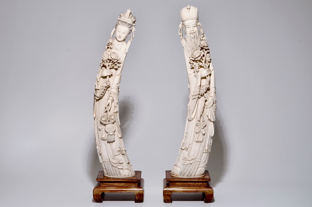 A pair of very large Chinese ivory figures of a man and a woman, ca. 1900